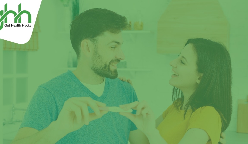 A man and a woman with happy faces after seeing a postive pregnancy text due to taking antioxidants for male fertility